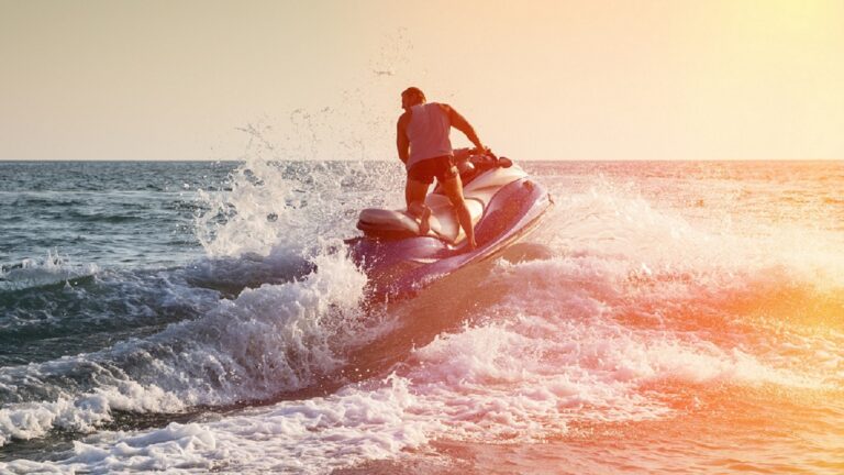 Silhouette,Of,Strong,Man,Jumps,On,The,Jetski,Above,The