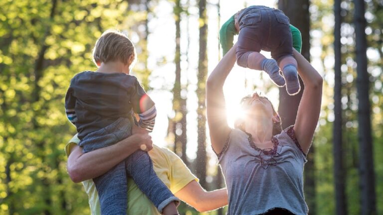 Parents playing with their two young children