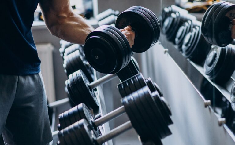 Strong man training in gym